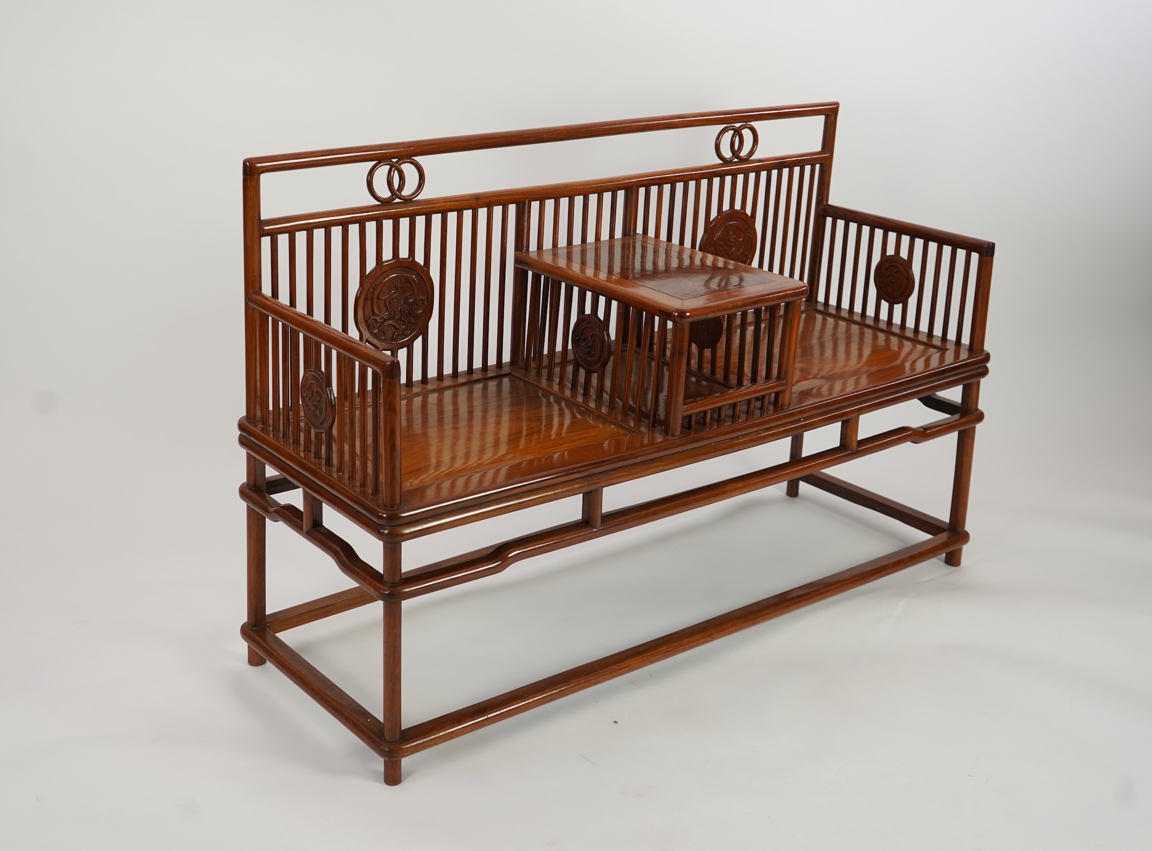 A Chinese hardwood and burrwood inset spindle-back bench, early 20th century